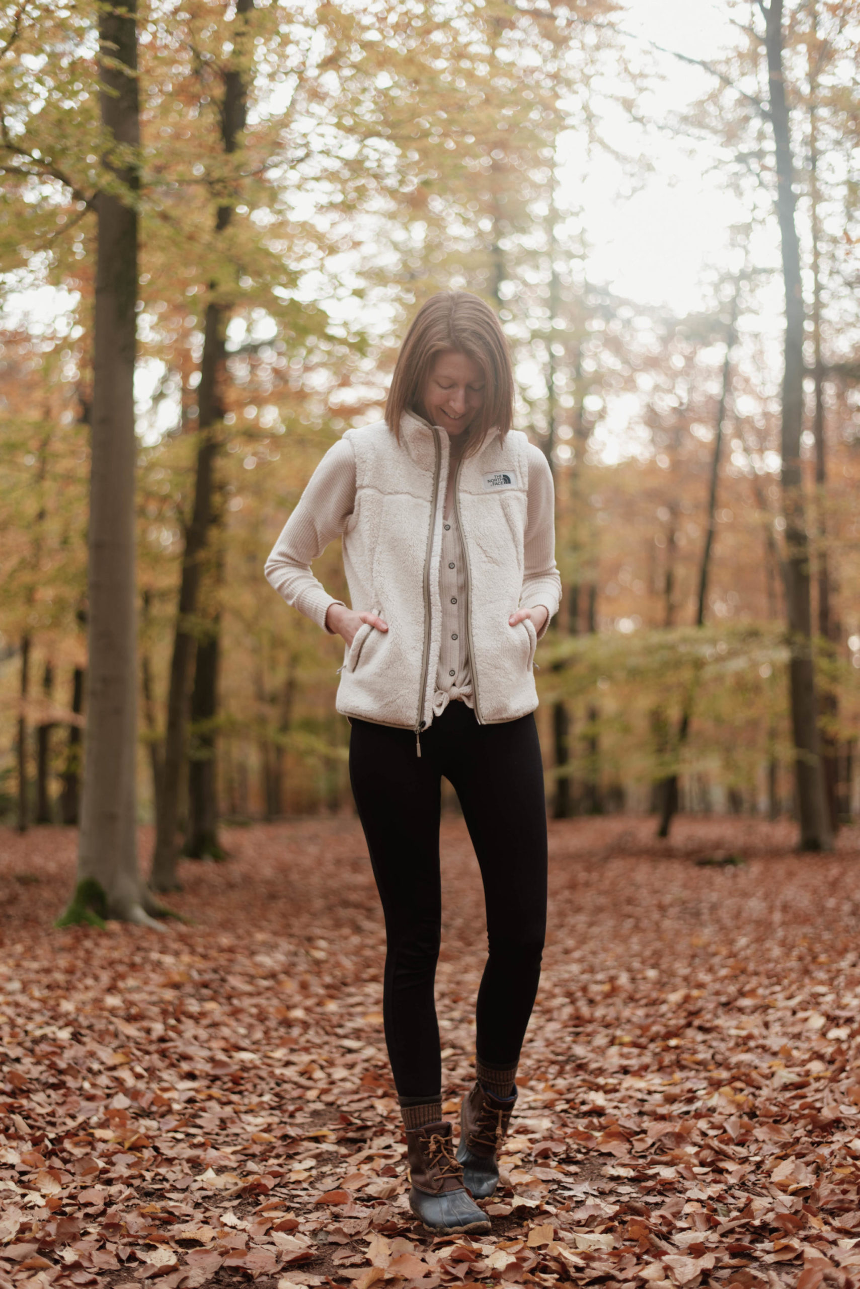 Women's outfit with shearling vest and leggings