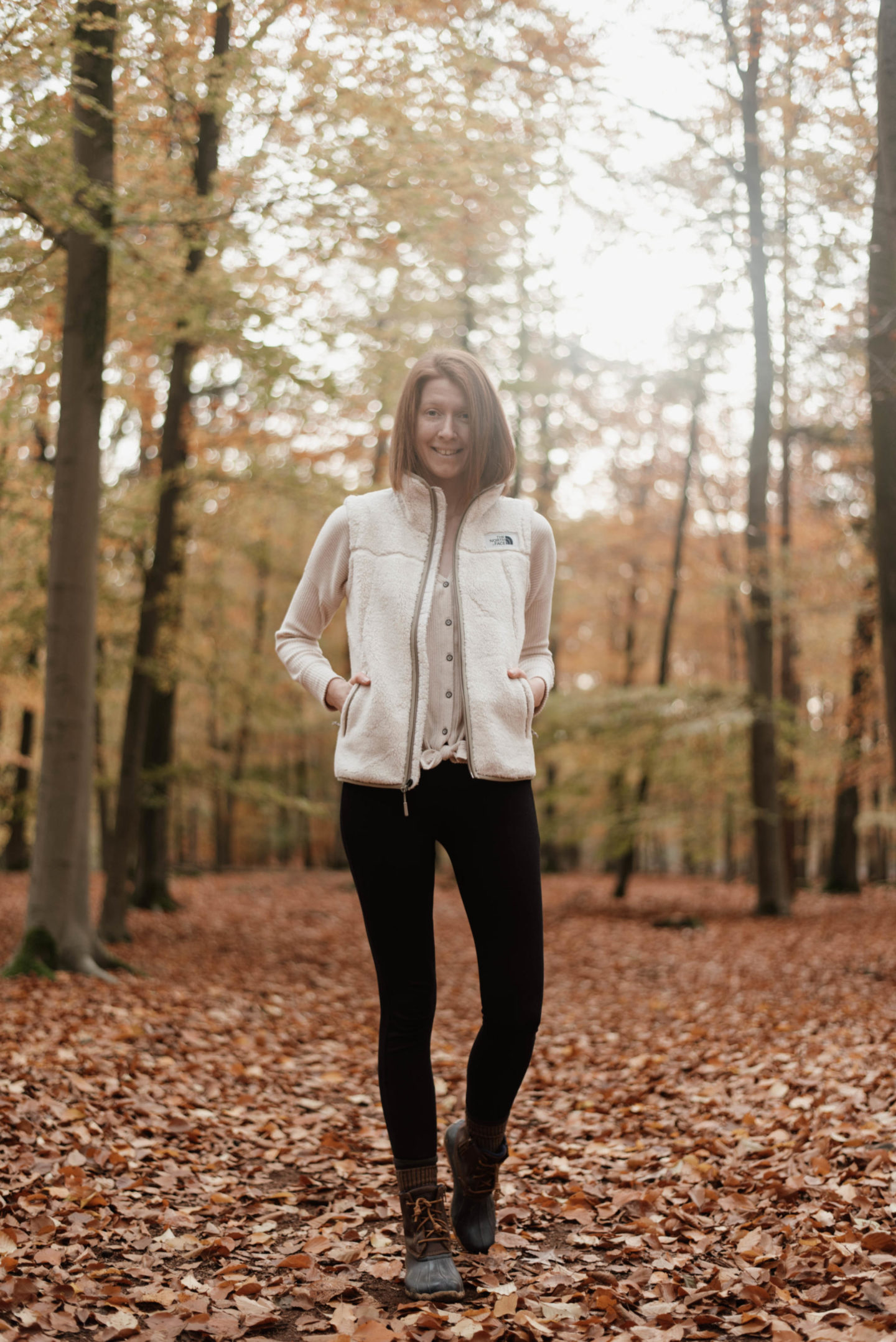 Women's outfit with shearling vest and leggings