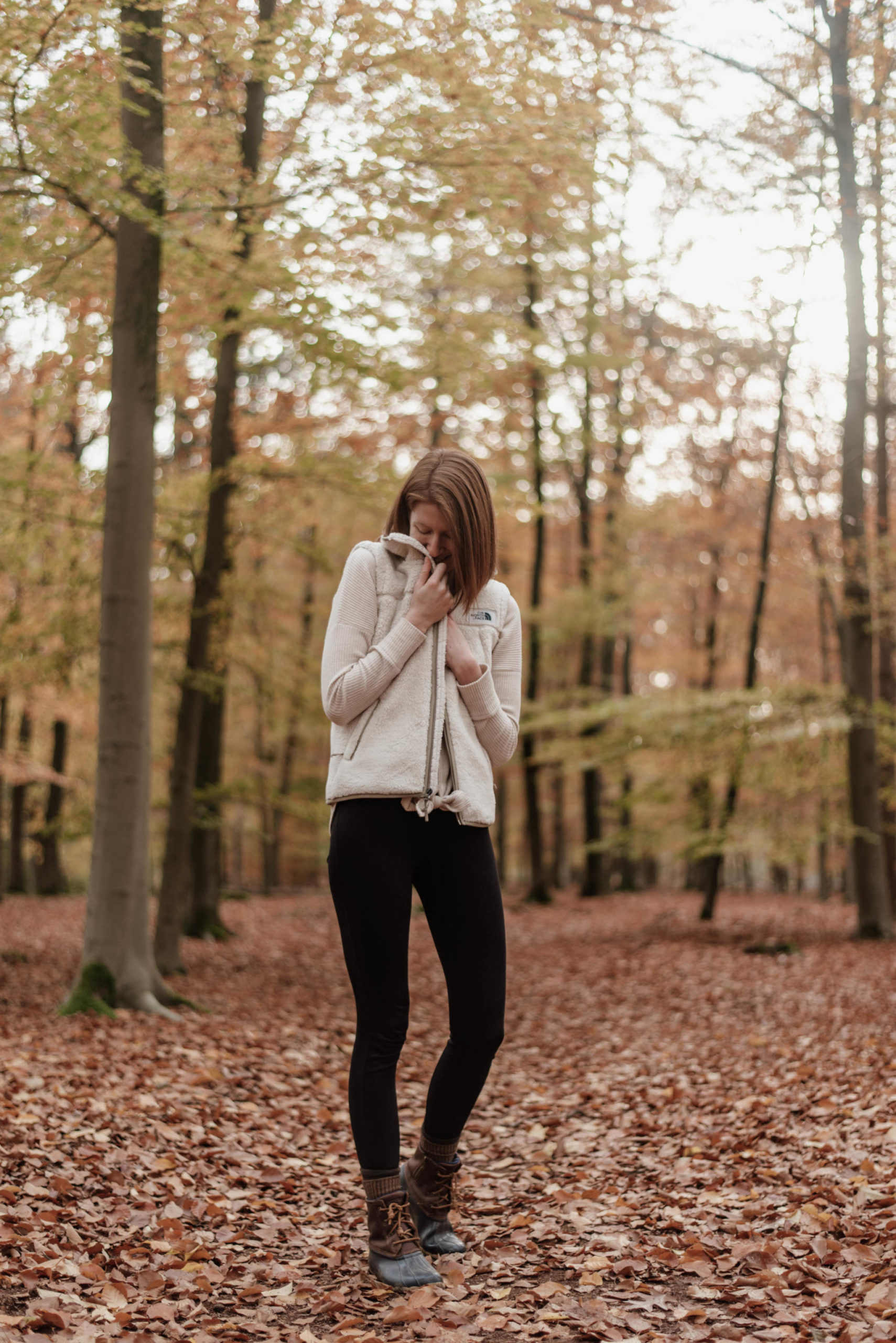 Women's outfit with shearling vest and leggings