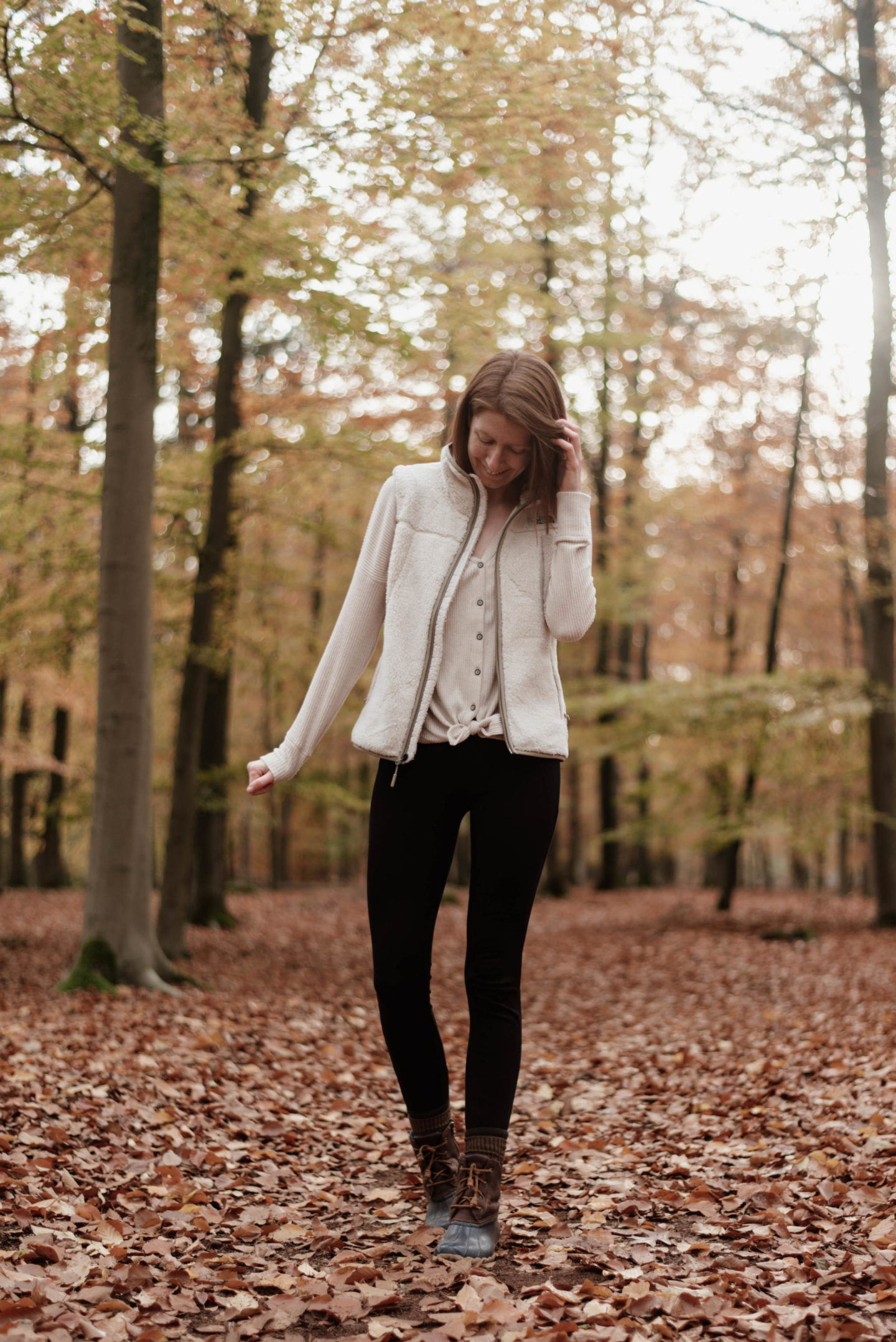 Women's outfit with shearling vest and leggings