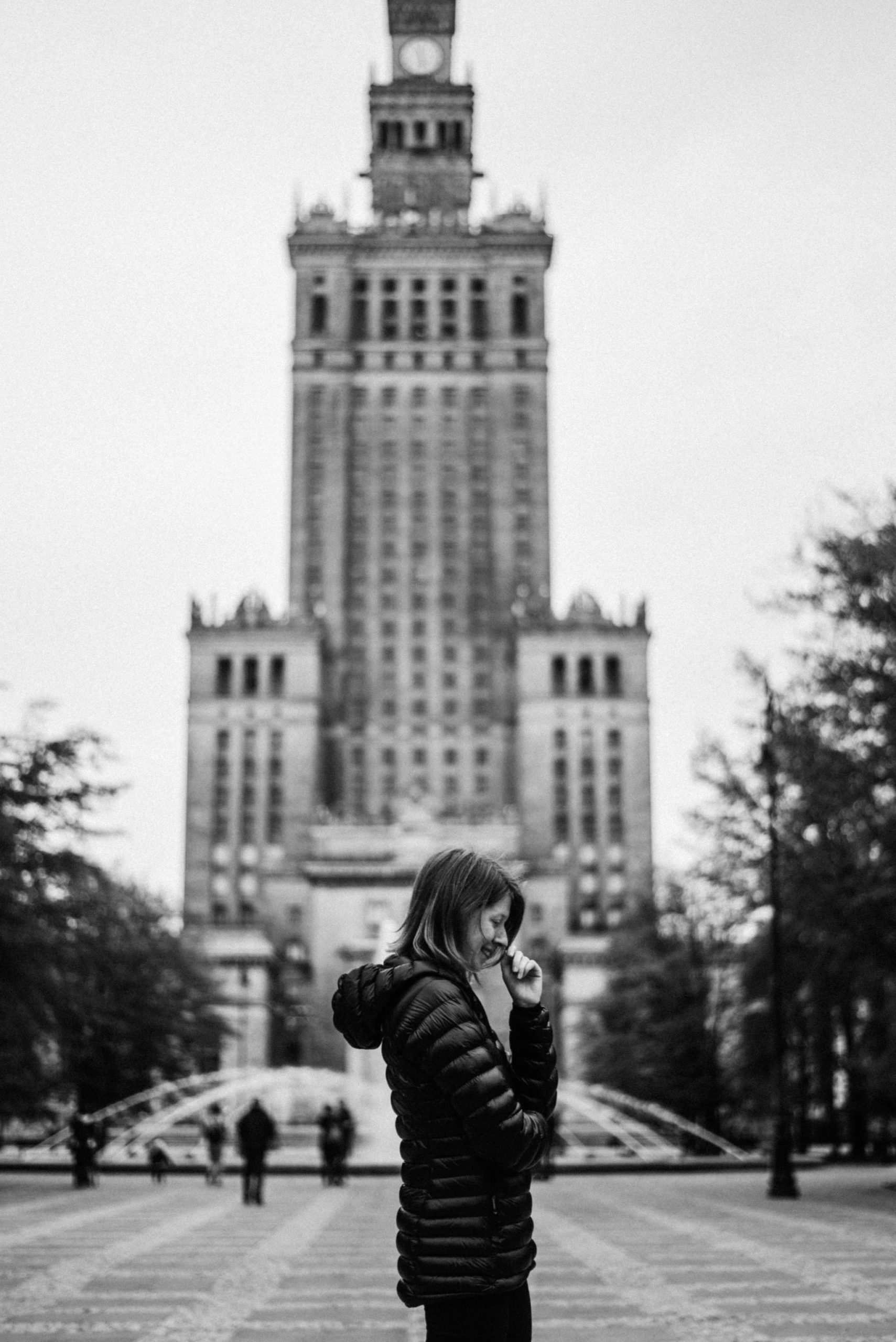 Girl in front of Warsaw palace of culture and science