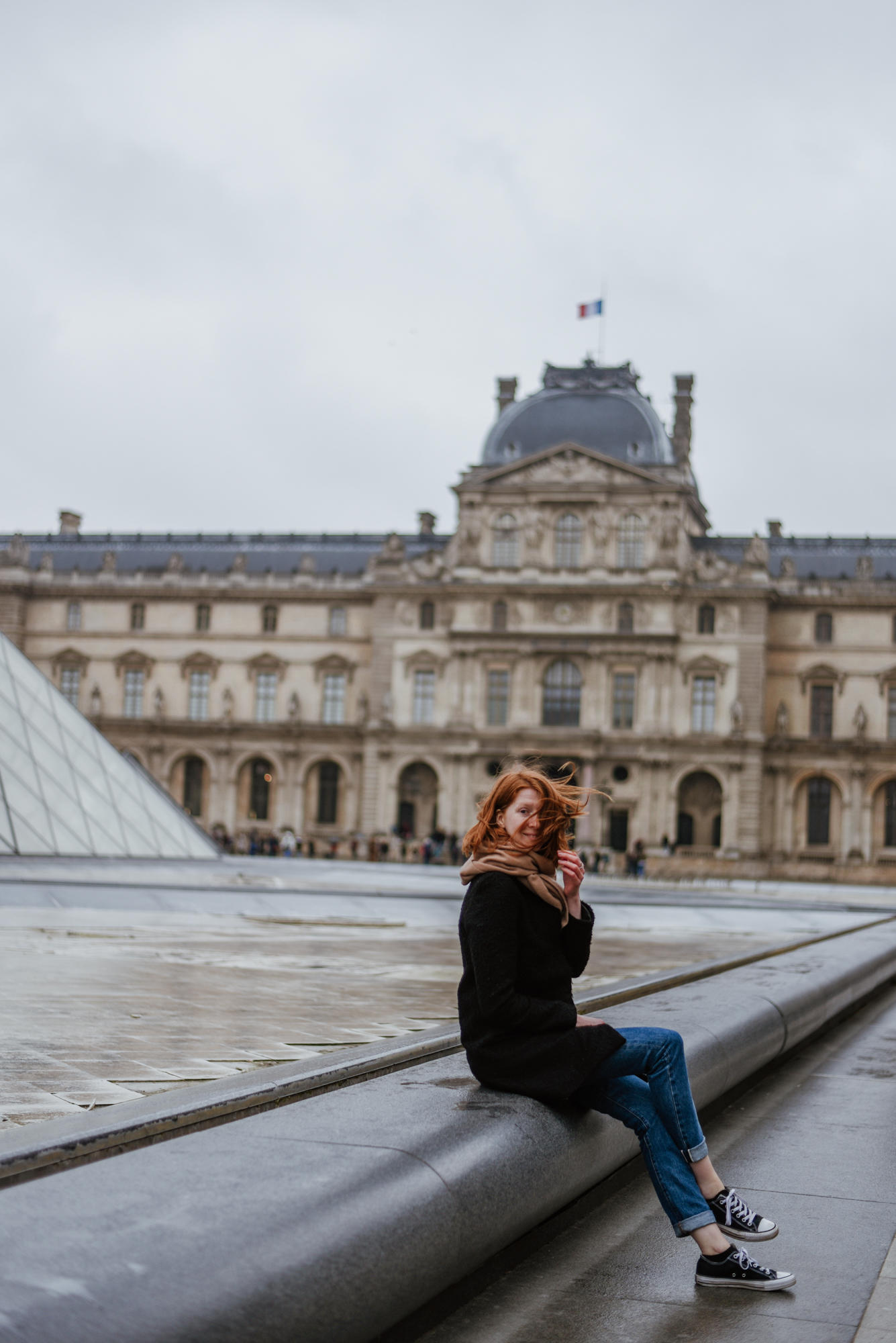 Girl in front of The Liuvre Museum in Paris