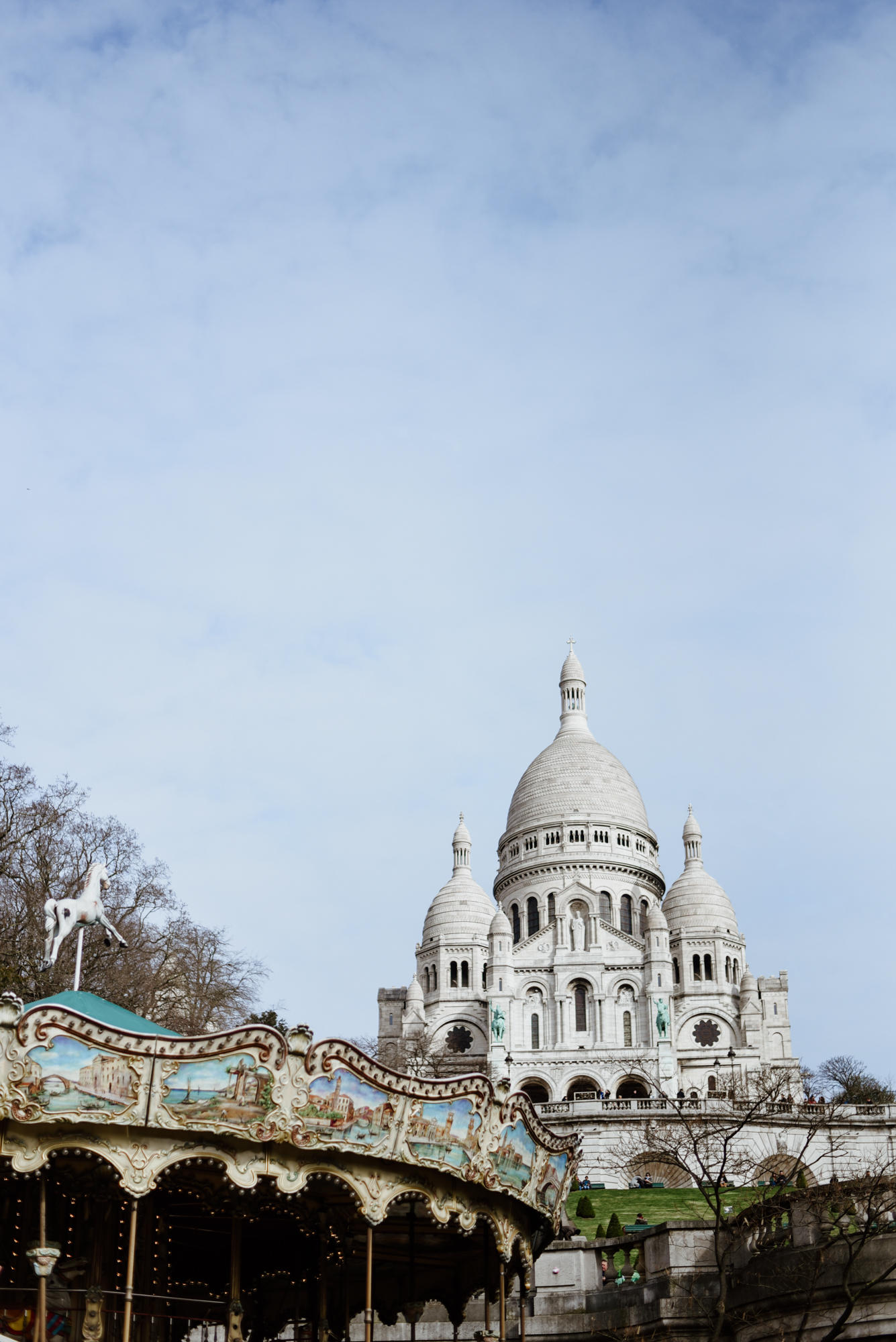 old carousel and basilique sacre coeur in paris