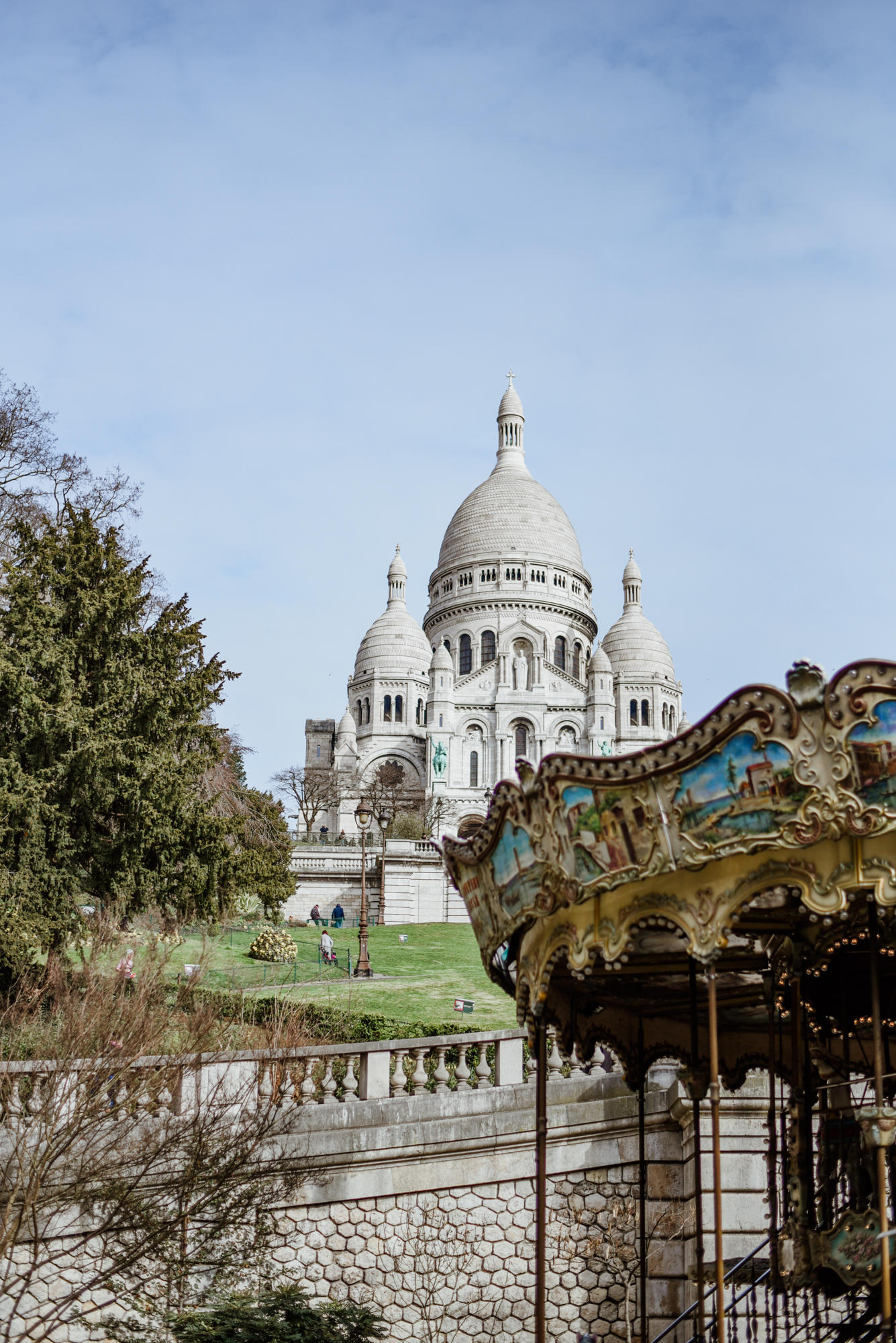 old carousel and basilique sacre coeur in paris