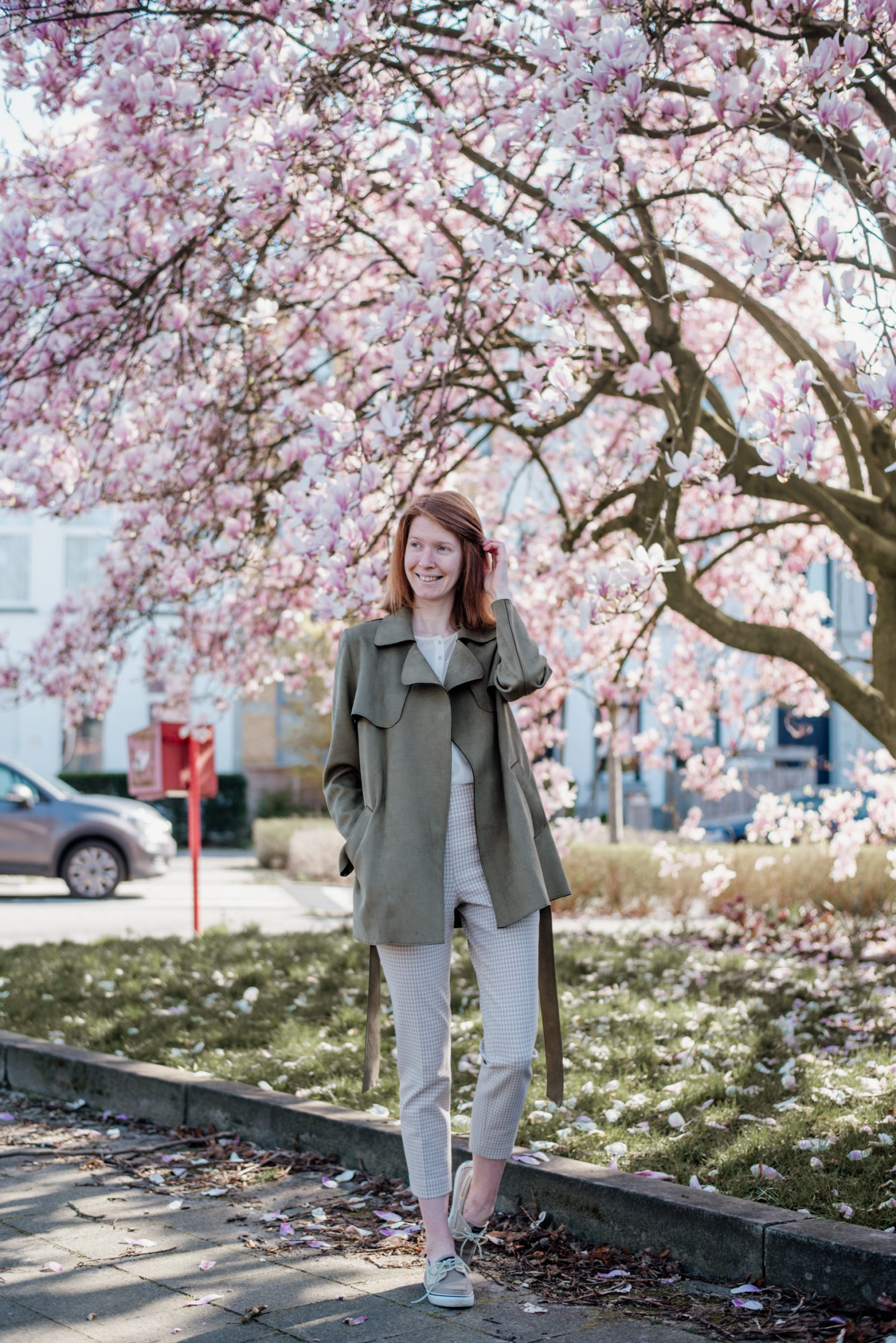 women's spring outfit with olive suede jacket